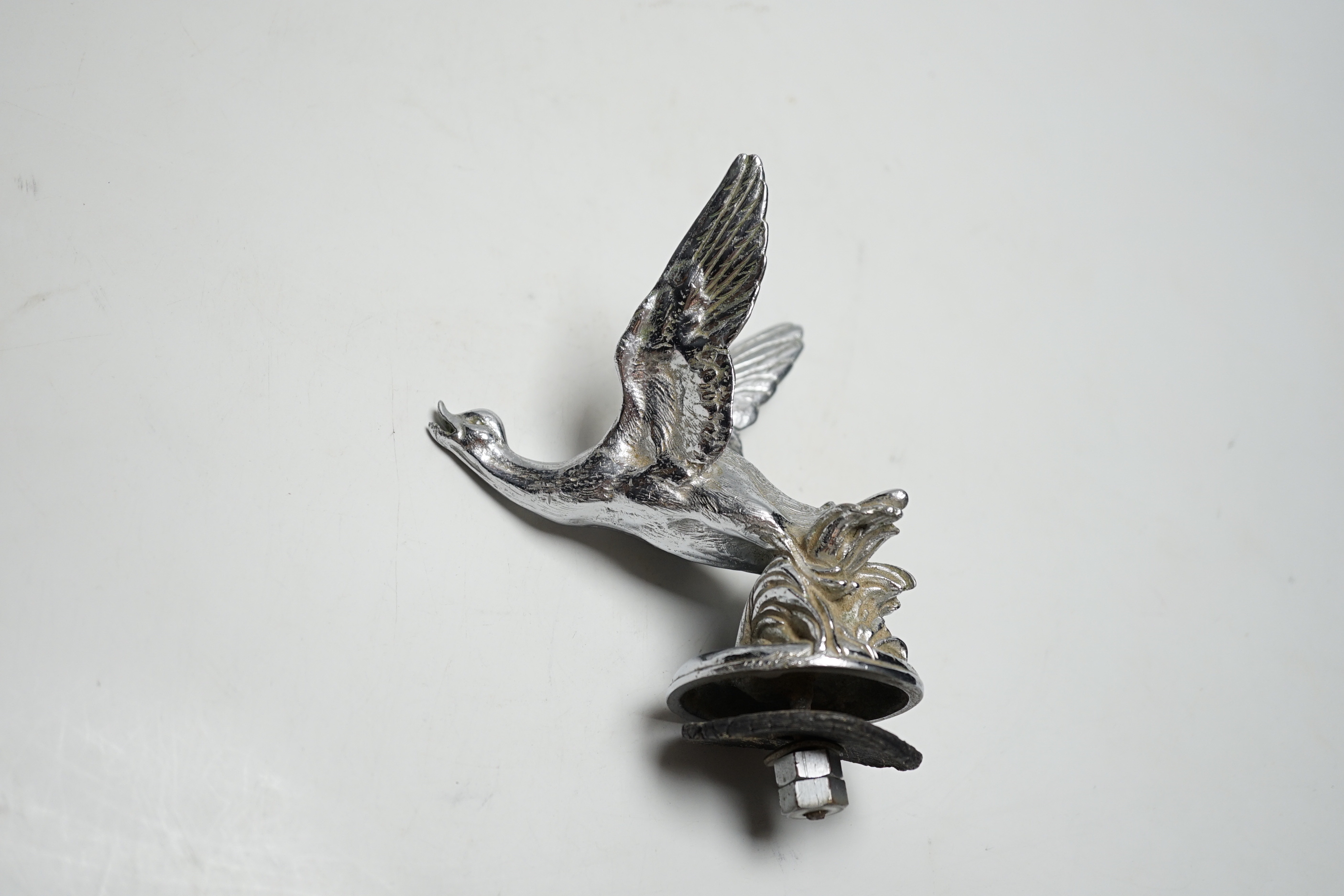 A chromium goose car mascot